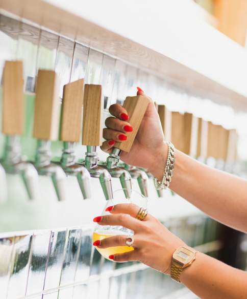 A staff member pulling a pint at the Wiper & True Taproom in East Bristol - credit Wiper & True
